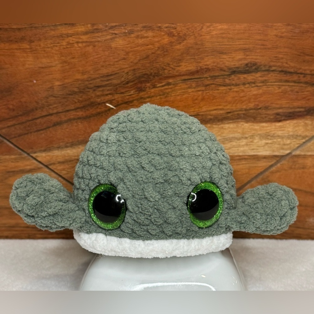 Handmade crocheted green whale plushy with sparkly eyes
